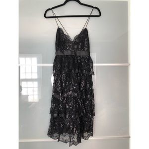 BLACK TIERED LACE MIDI DRESS W/ METALLIC APPLIQUÉS